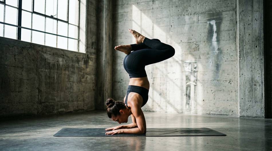 Woman practicing yoga for mental focus to improve concentration and productivity.
